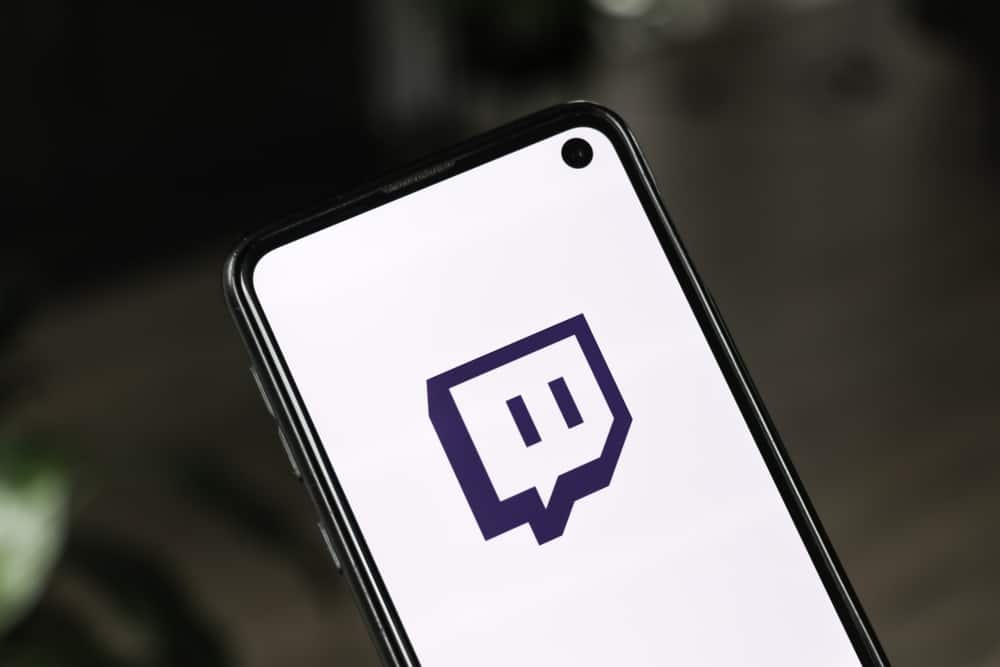 Twitch logo on phone screen in this image from Shutterstock