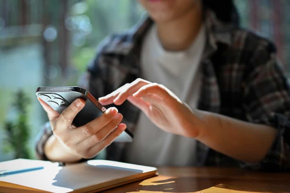 Young person using cell phone