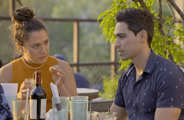 Mallory and Salvador talk over wine