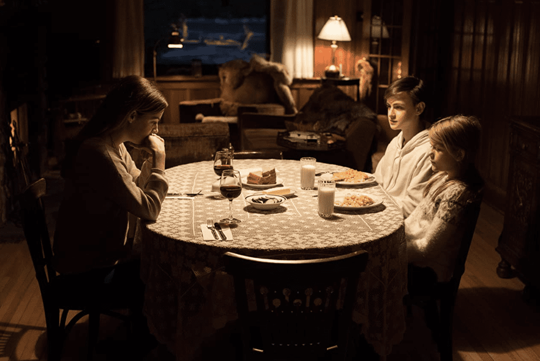 Riley Keough as Grace Marshall, Jaeden Martell as Aiden Hall, and Lia McHugh as Mia Hall in the movie The Lodge